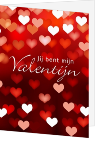 Valentijnskaart hartjes in rood en wit